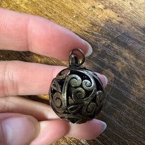 Elegant Bronze Pendant with Intricate Design